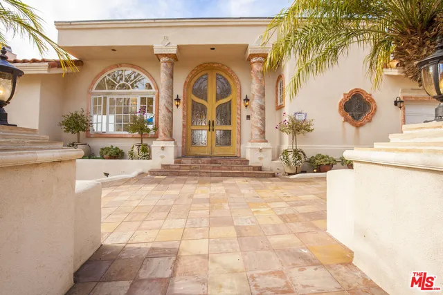 a view of an entryway and wooden floor