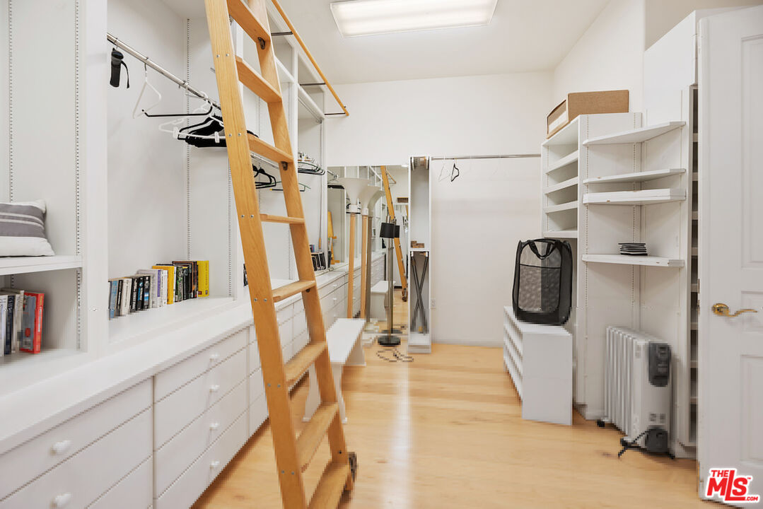 7350 Brodiaea Way La Jolla, CA 92037 - Photo 35 of 60 a view of walk in closet with clothes and shoes
