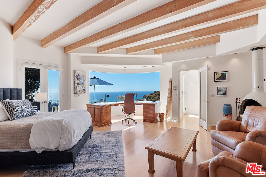 7350 Brodiaea Way La Jolla, CA 92037 - Photo 39 of 60 a living room with furniture and wooden floor