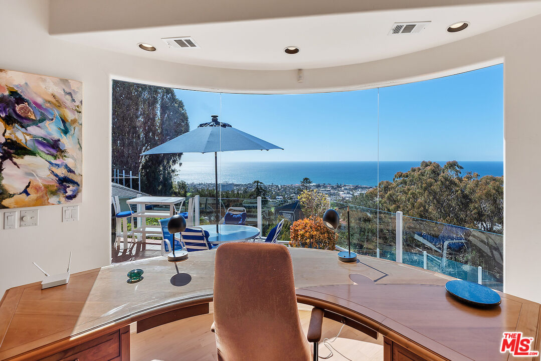7350 Brodiaea Way La Jolla, CA 92037 - Photo 40 of 60 a dining room with furniture and a floor to ceiling window