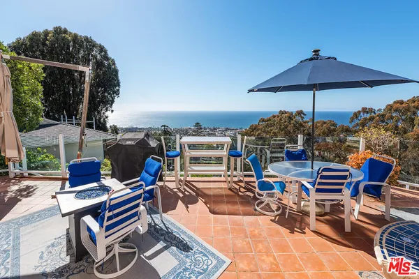 a bedroom with furniture and wooden floor