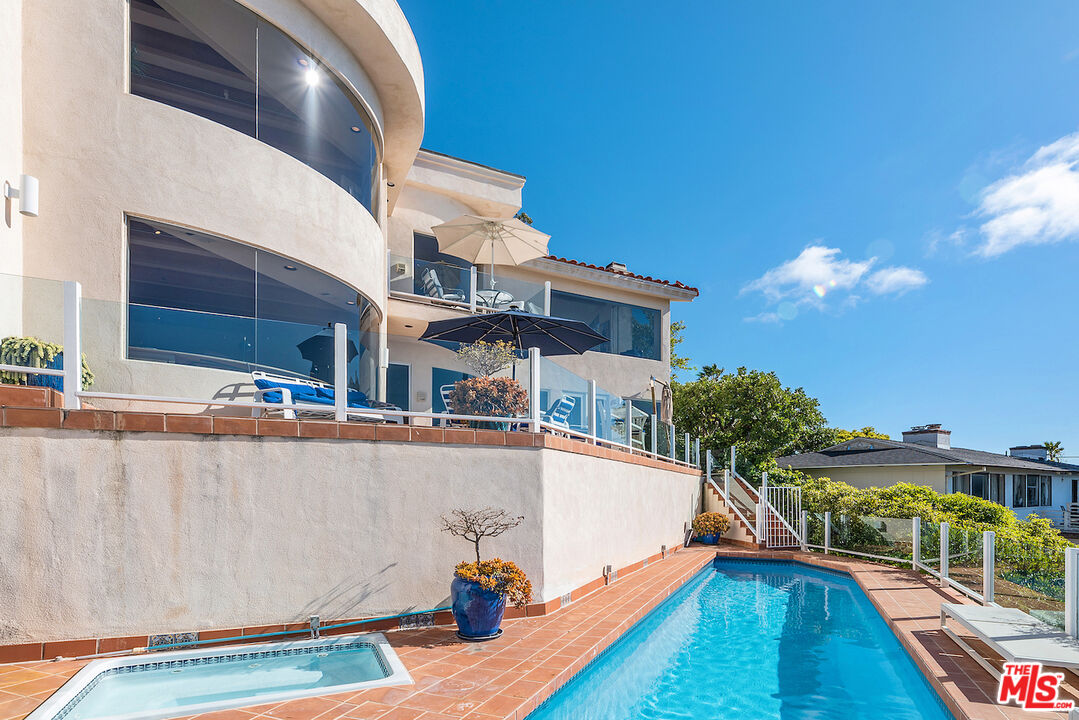 7350 Brodiaea Way La Jolla, CA 92037 - Photo 56 of 60 a view of a living room with a swimming pool