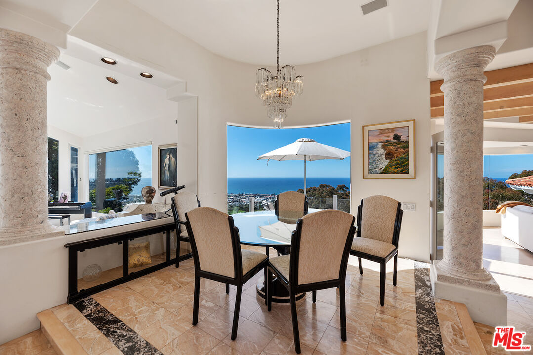 7350 Brodiaea Way La Jolla, CA 92037 - Photo 9 of 60 a view of a dining room with furniture and chandelier