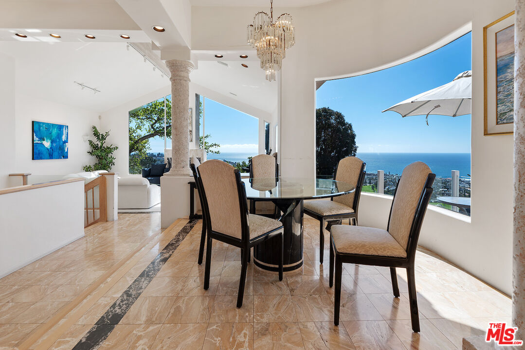7350 Brodiaea Way La Jolla, CA 92037 - Photo 10 of 60 a view of a dining room with furniture and wooden floor