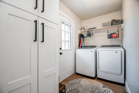 a view of a chairs and table in a yard