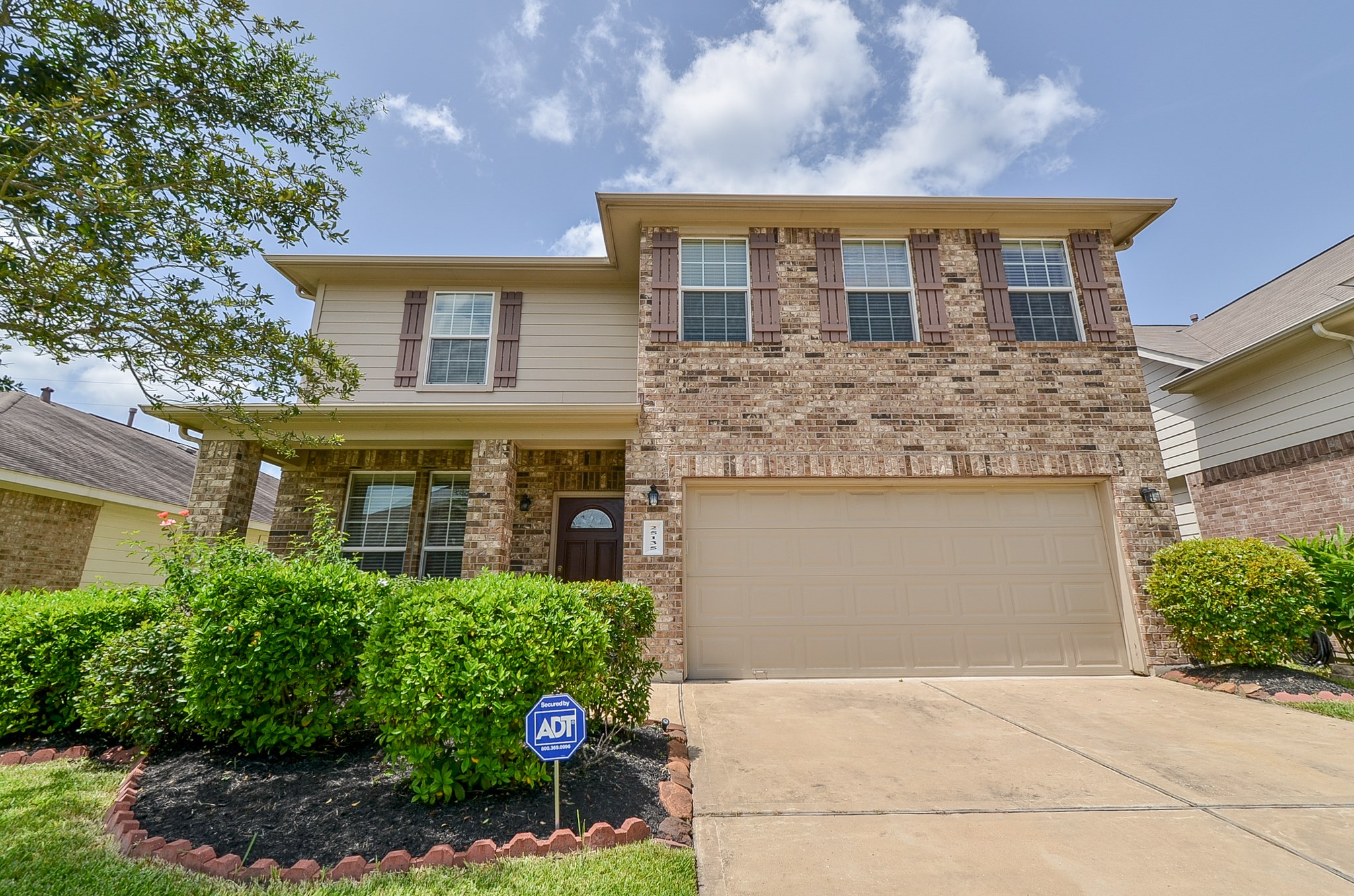 25135 Ginger Ranch Drive Katy, TX 77494 - Photo 3 of 32 Attractive two-story brick elevation with a covered entry and attached two-car garage adds strong curb appeal.