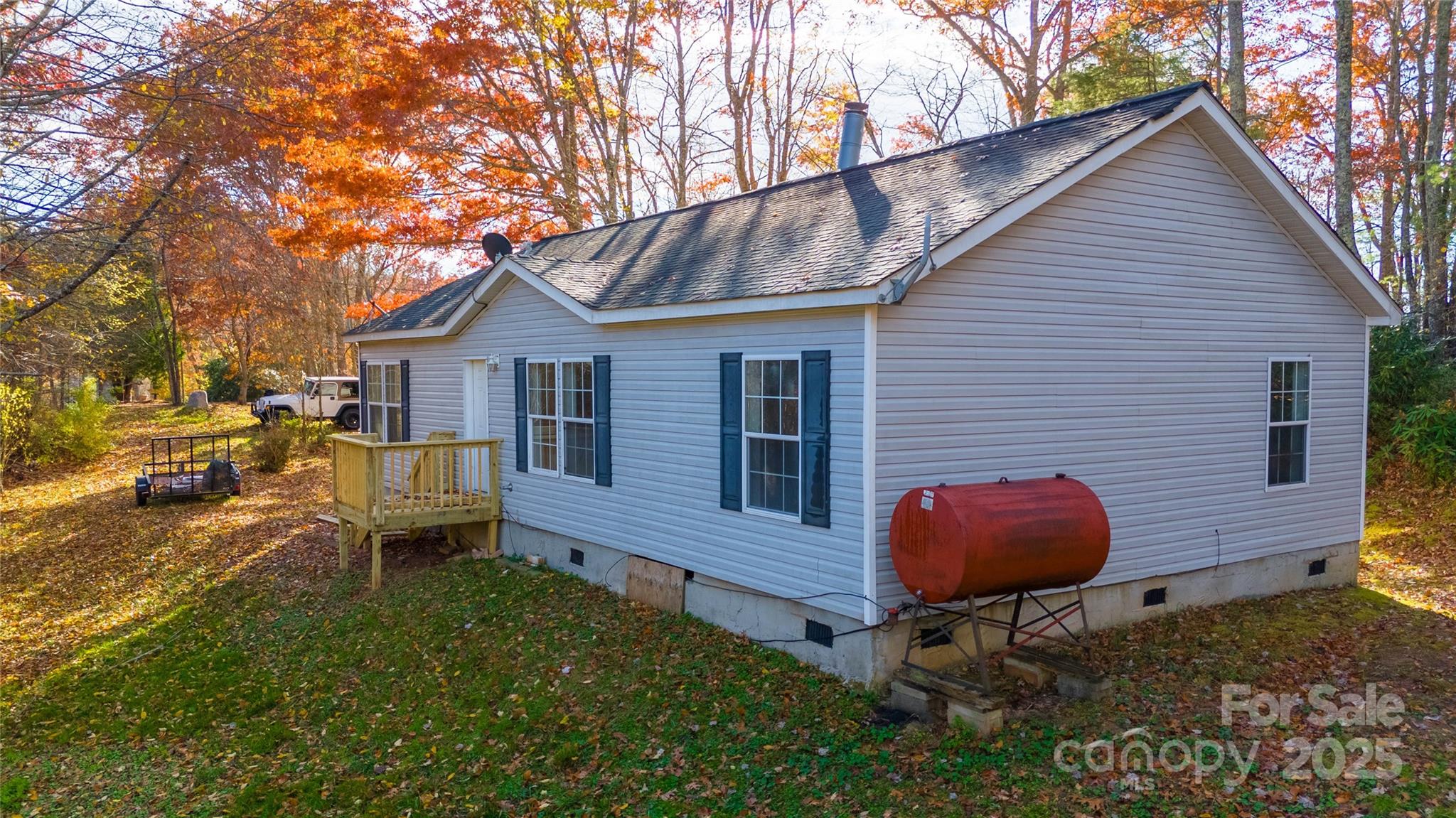 1960 Hanging Rock Road Spruce Pine, NC 28777 - Photo 14 of 47 a backyard of a house with table and chairs