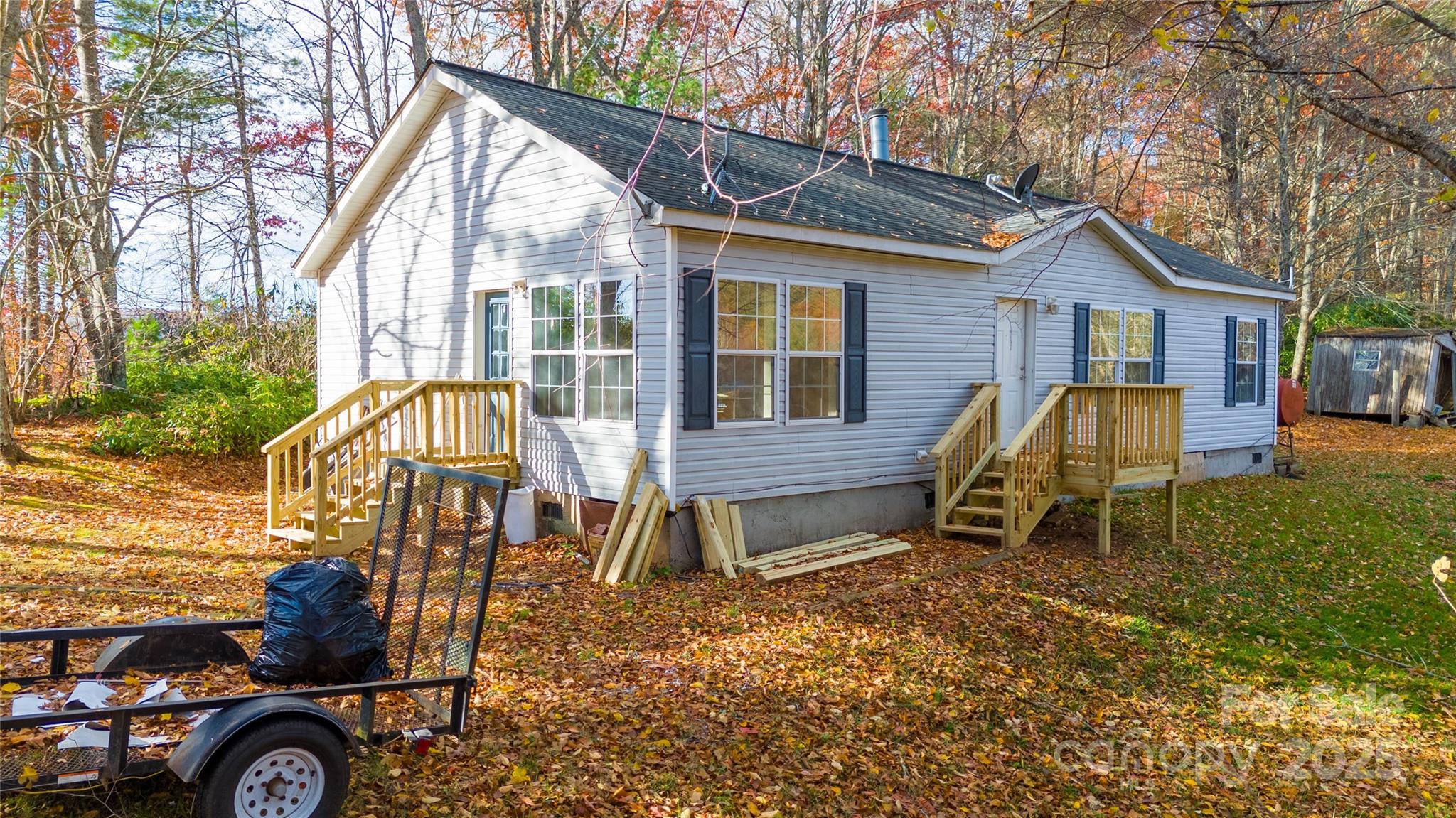 1960 Hanging Rock Road Spruce Pine, NC 28777 - Photo 18 of 47 a view of a house with a yard and furniture