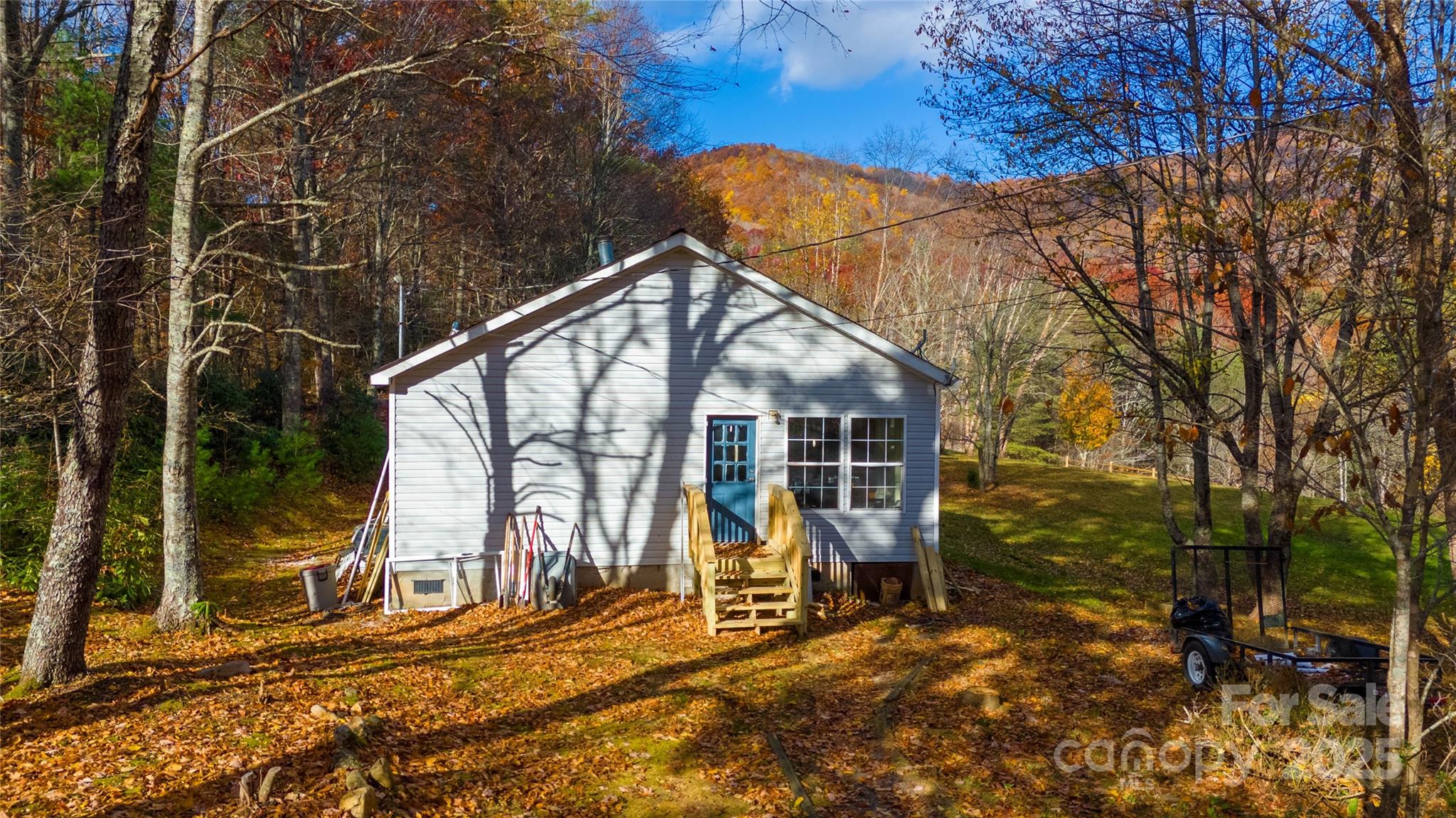 1960 Hanging Rock Road Spruce Pine, NC 28777 - Photo 19 of 47 a view of a house with backyard and sitting area