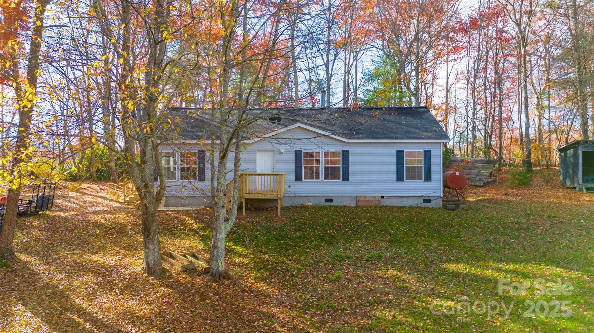 1960 Hanging Rock Road Spruce Pine, NC 28777 - Photo 20 of 47 a house that has a tree in front of a house