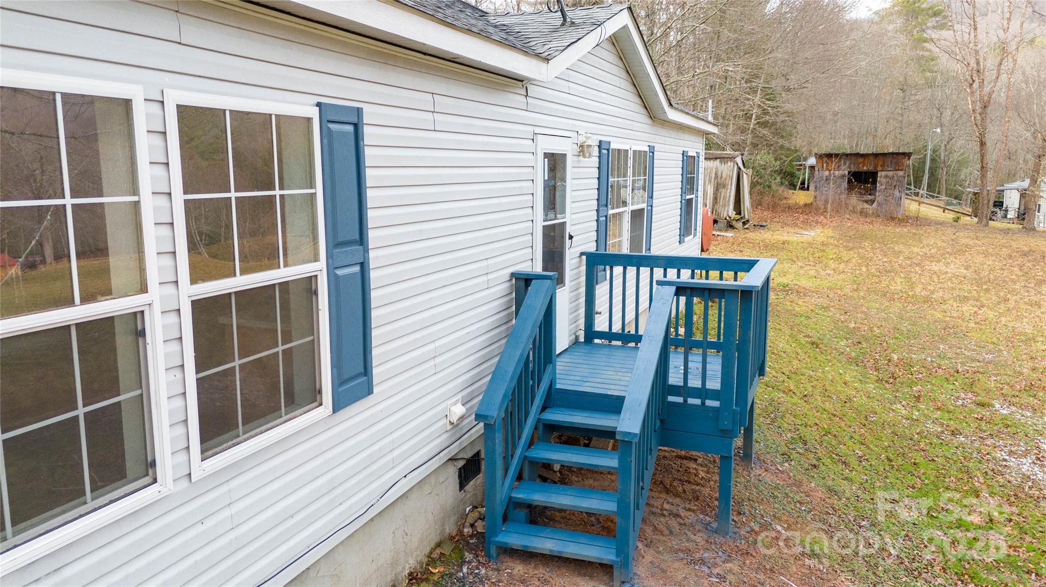 1960 Hanging Rock Road Spruce Pine, NC 28777 - Photo 24 of 47 a view of a house with wooden deck front of house