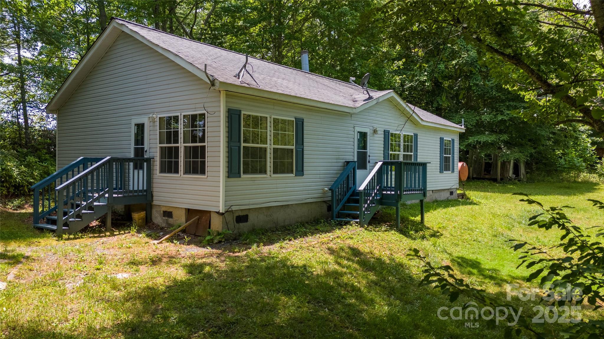 1960 Hanging Rock Road Spruce Pine, NC 28777 - Photo 3 of 47 a view of a house with a yard