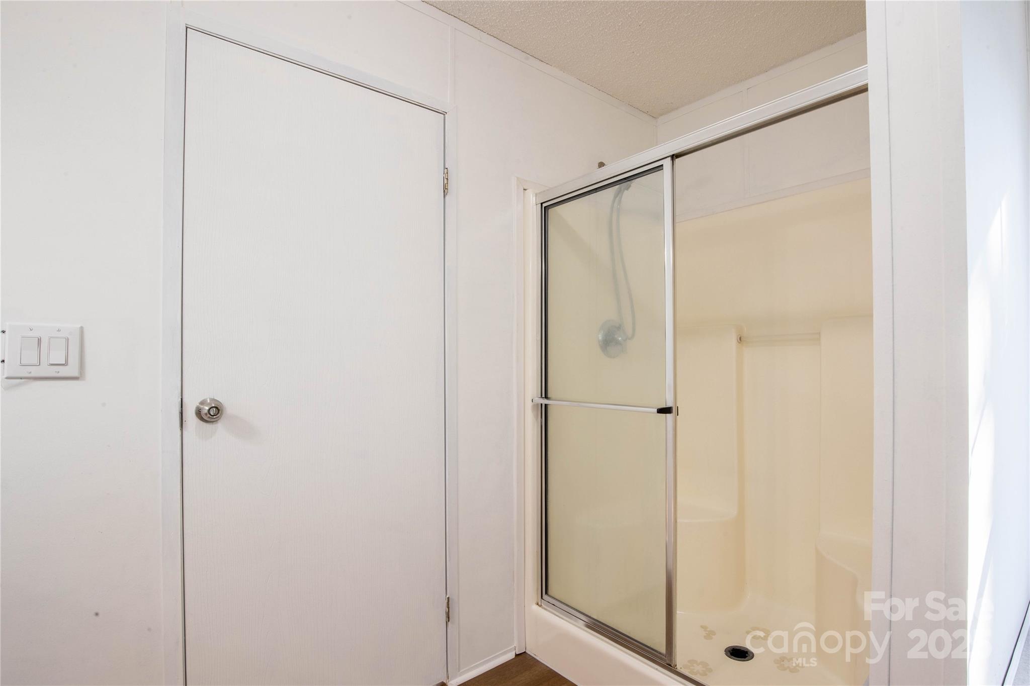 1960 Hanging Rock Road Spruce Pine, NC 28777 - Photo 39 of 47 a bathroom with a glass shower door