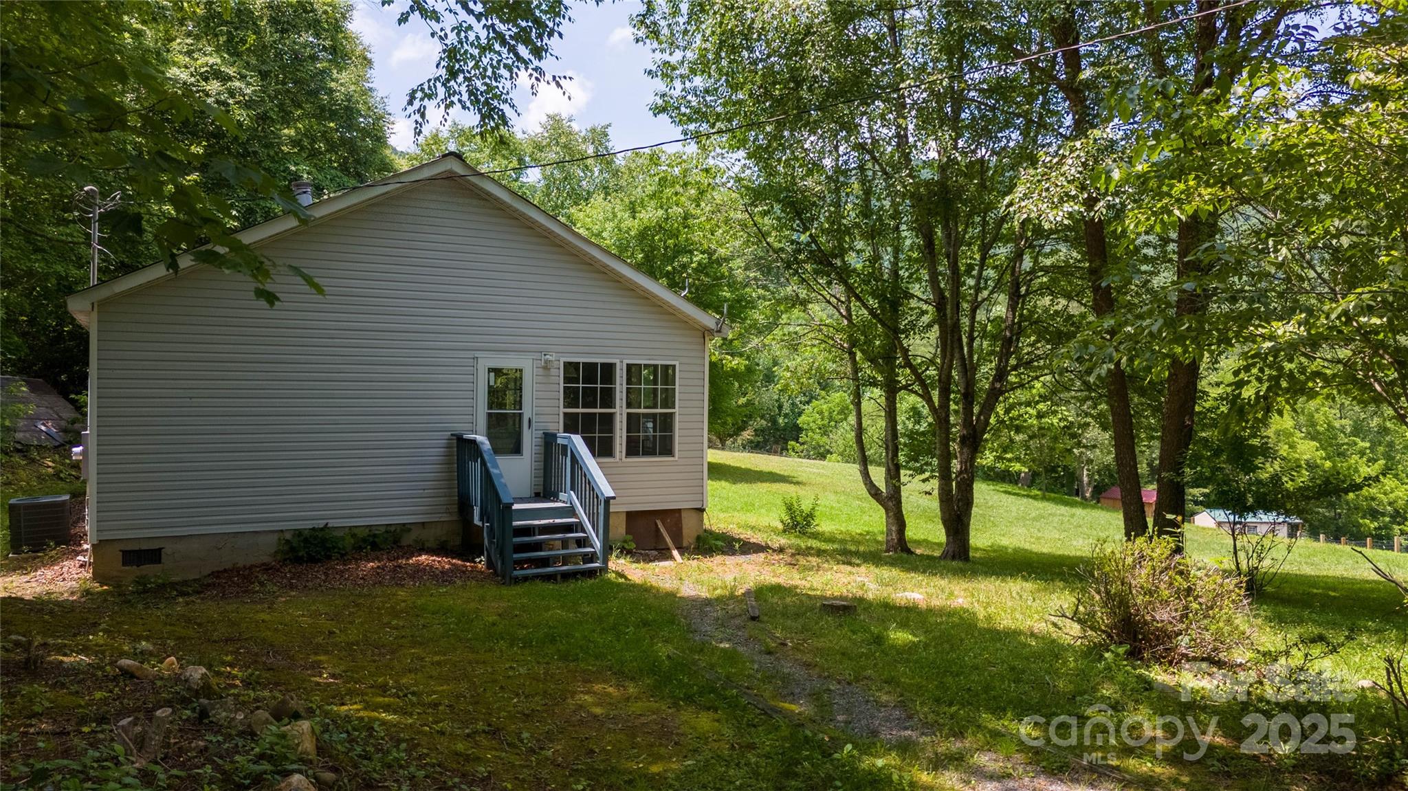 1960 Hanging Rock Road Spruce Pine, NC 28777 - Photo 4 of 47 a view of a house with backyard