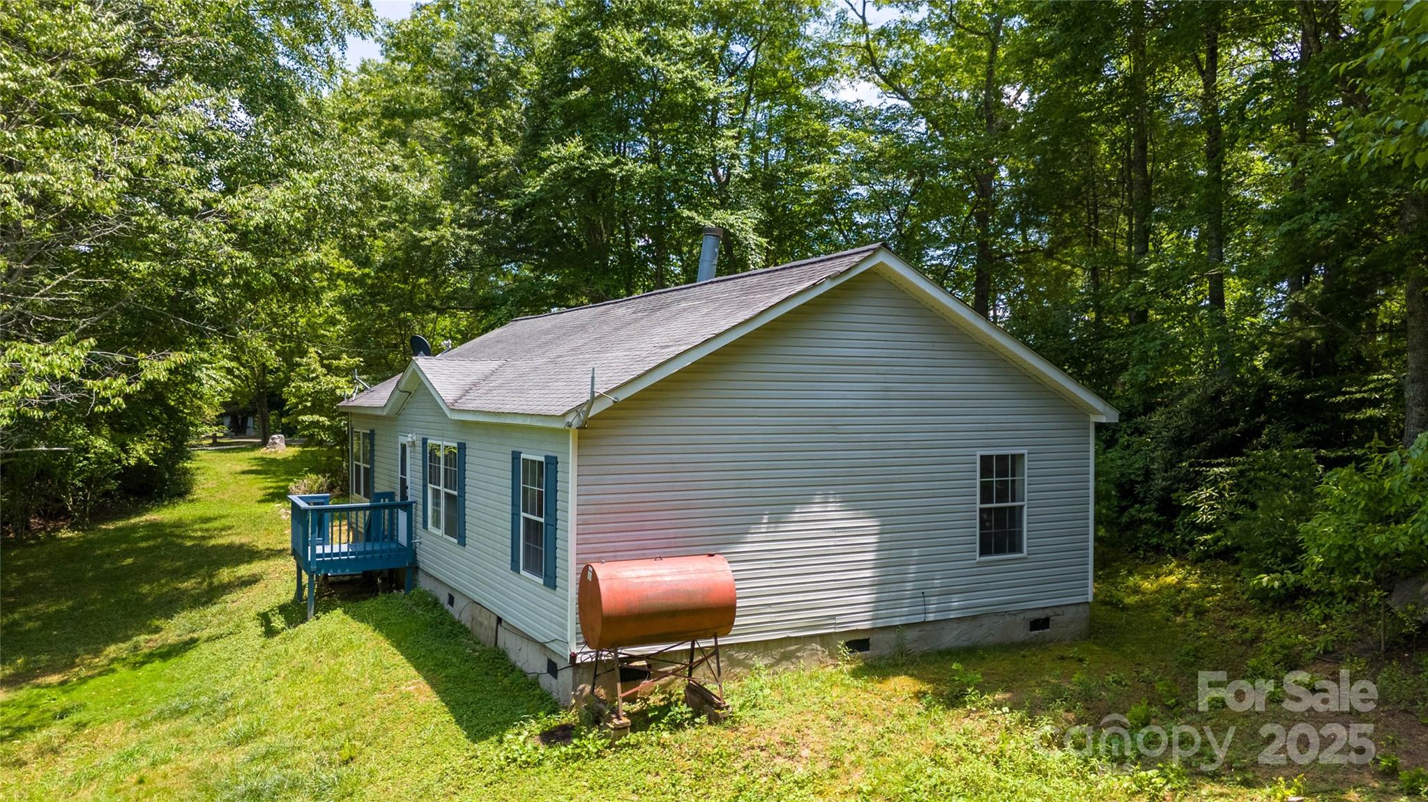 1960 Hanging Rock Road Spruce Pine, NC 28777 - Photo 5 of 47 a front view of a house with garden