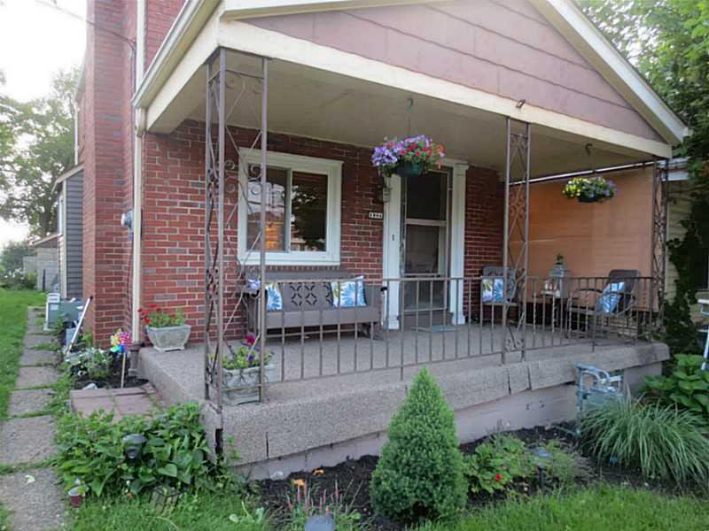 Exterior Front. Enjoy relaxing on the large covered front porch with new capeting