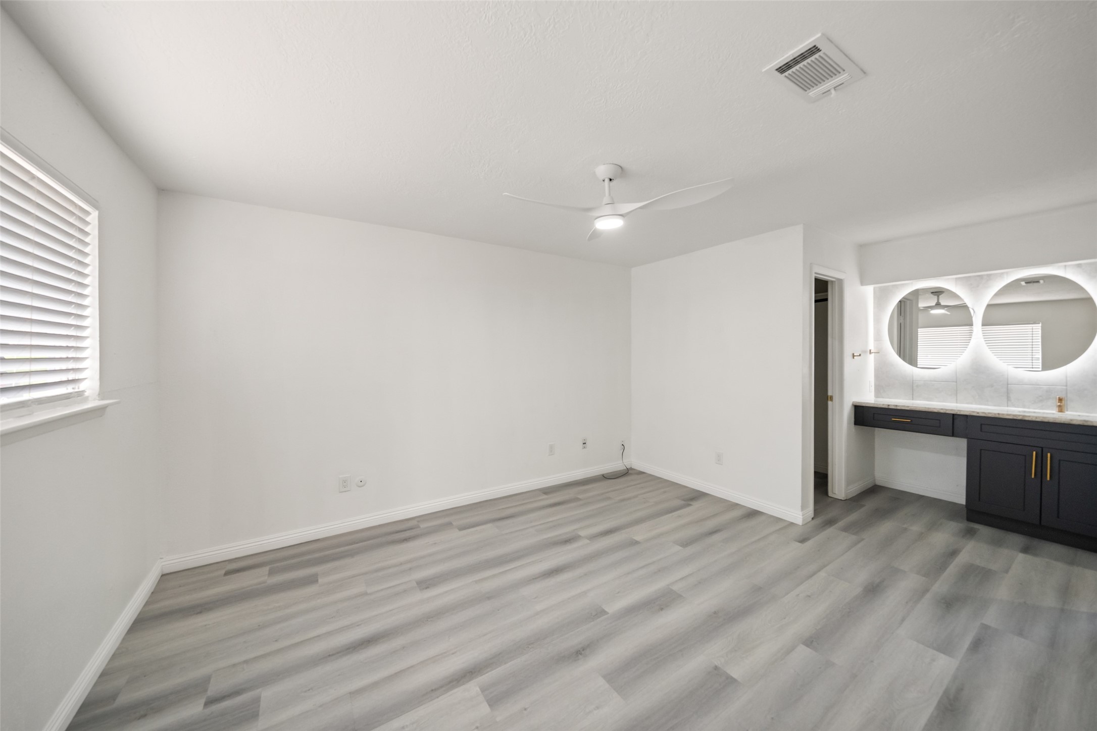 5726 Yorkgate Drive Spring, TX 77373 - Photo 13 of 20 an empty room with wooden floor and window
