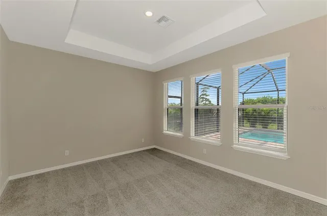 a view of an empty room and closet area