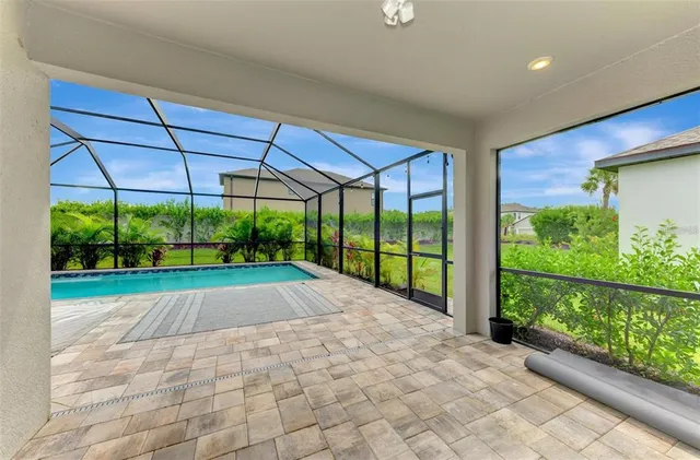 a view of swimming pool with deck and patio