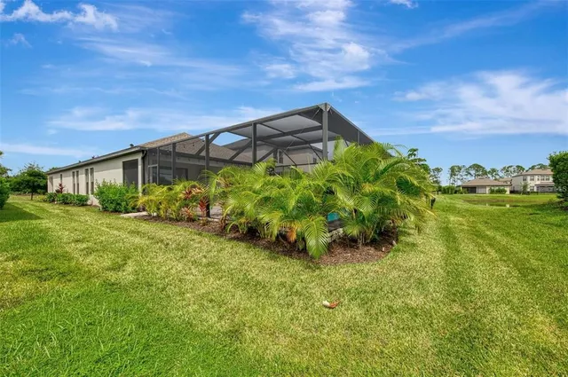 a view of a yard with a table and chairs