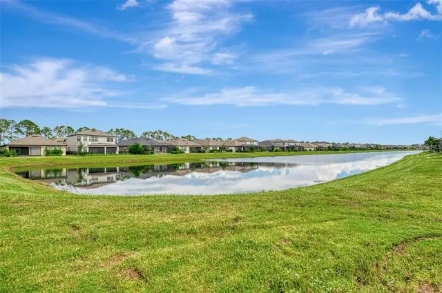 an aerial view of house with swimming pool garden and patio