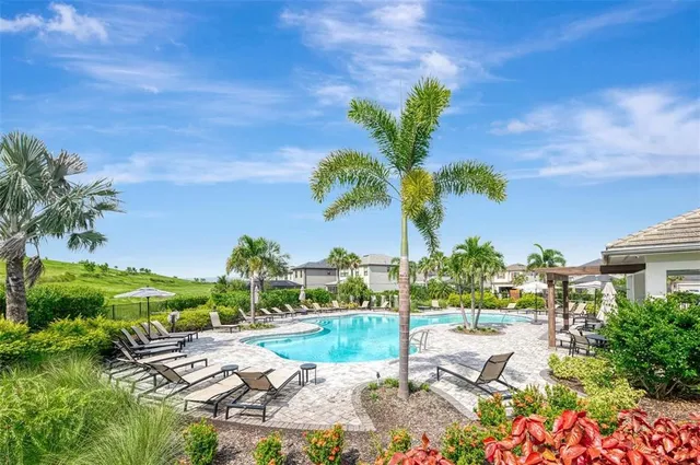 an aerial view of a house with a ocean view