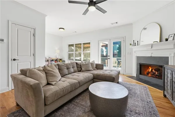 a living room with furniture and a fireplace