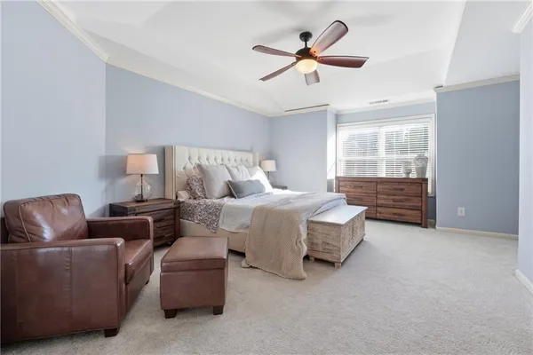 a bedroom with bed and window