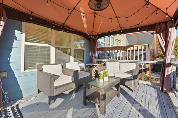 a outdoor living space with furniture and a potted plant