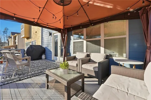 a table and chairs in front of a house
