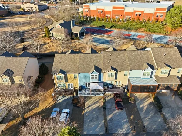 an aerial view of residential houses with outdoor space