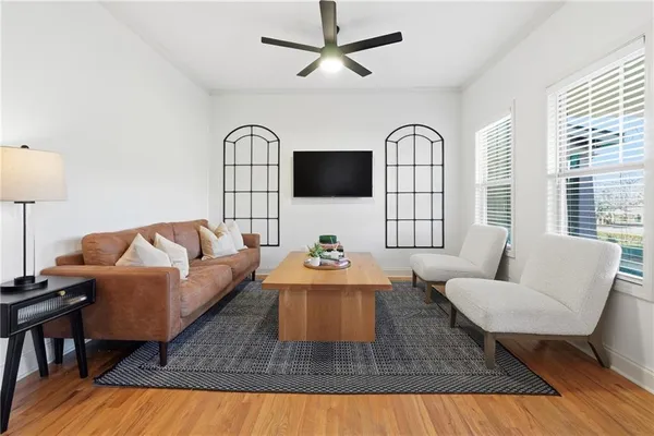 a living room with furniture fireplace and a flat screen tv
