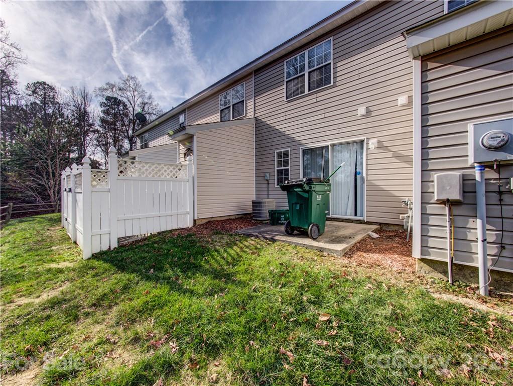 8178 Rudolph Road Charlotte, NC 28216 - Photo 19 of 20 a backyard of a house with table and chairs