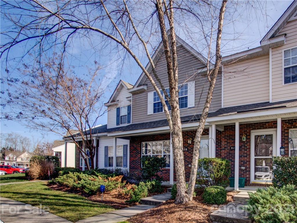 8178 Rudolph Road Charlotte, NC 28216 - Photo 3 of 20 a front view of a house with garden and plants
