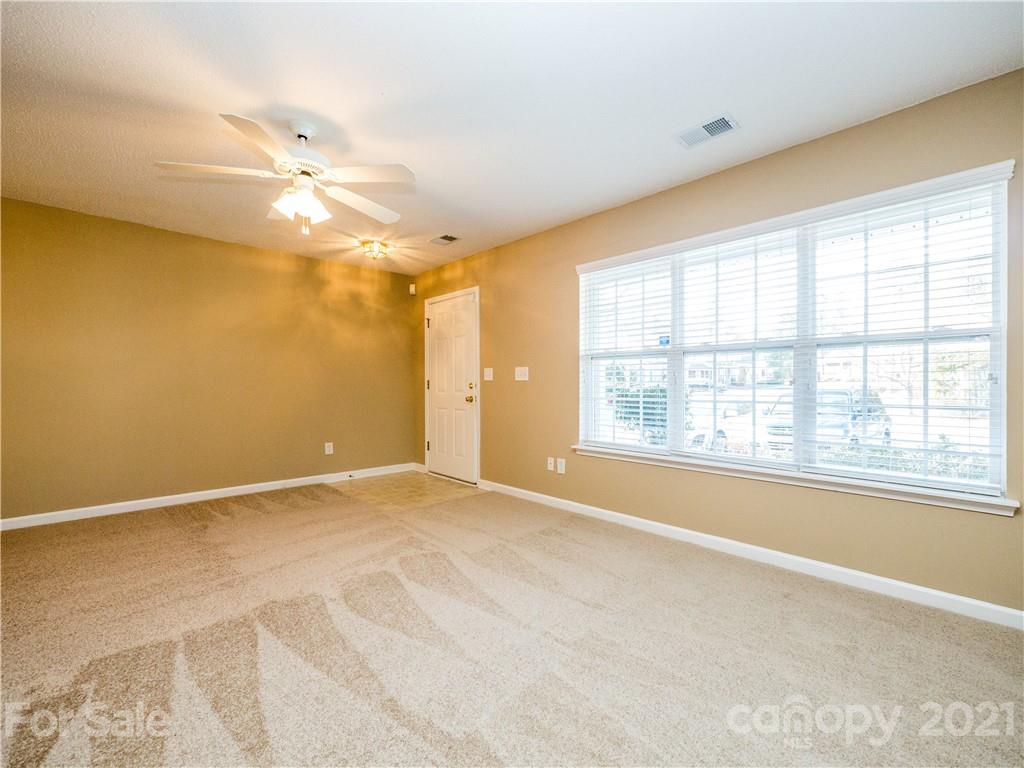 8178 Rudolph Road Charlotte, NC 28216 - Photo 6 of 20 a view of an empty room with a window