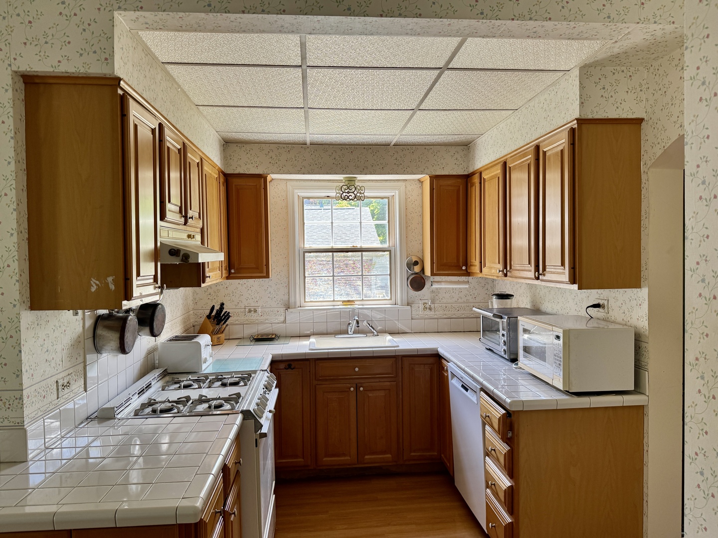 933 Harms Road Glenview, IL 60025 - Photo 9 of 25 a kitchen with a sink stove top oven and cabinets