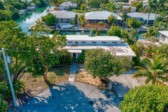 an aerial view of a house with a lake view