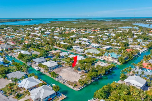 a view of an house with a yard and garden