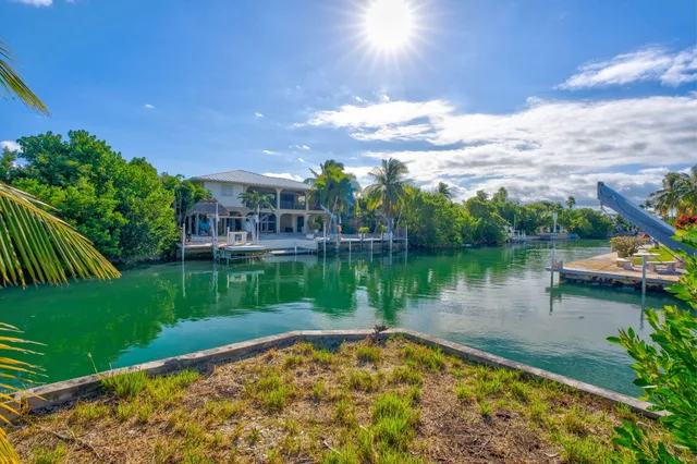 a view of a lake with a house in the background