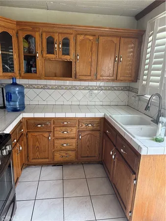 a kitchen with stainless steel appliances granite countertop a sink and cabinets