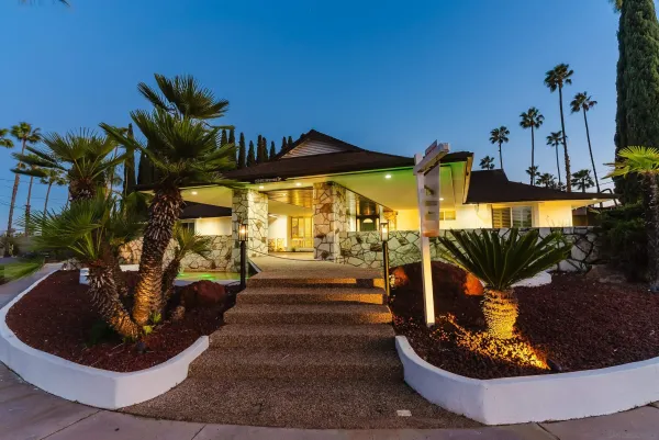a view of a living room and entryway