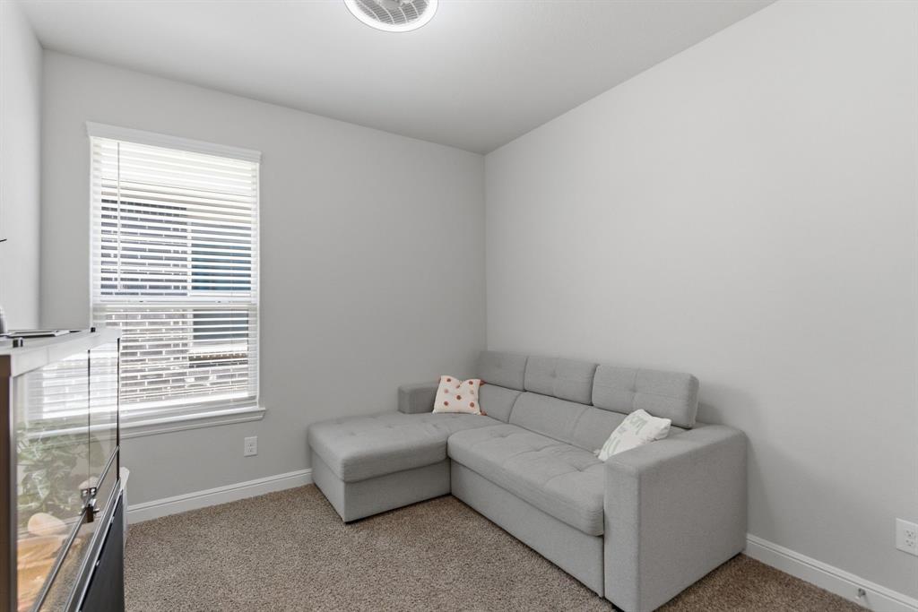 5621 Round Hl Road Denton, TX 76210 - Photo 22 of 27 a living room with furniture and a window