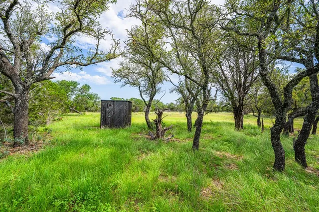 a view of a park with swings and slides