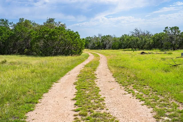 a view of an ocean with a mountain