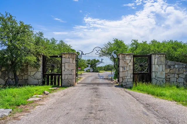 a wooden bench sitting in a yard