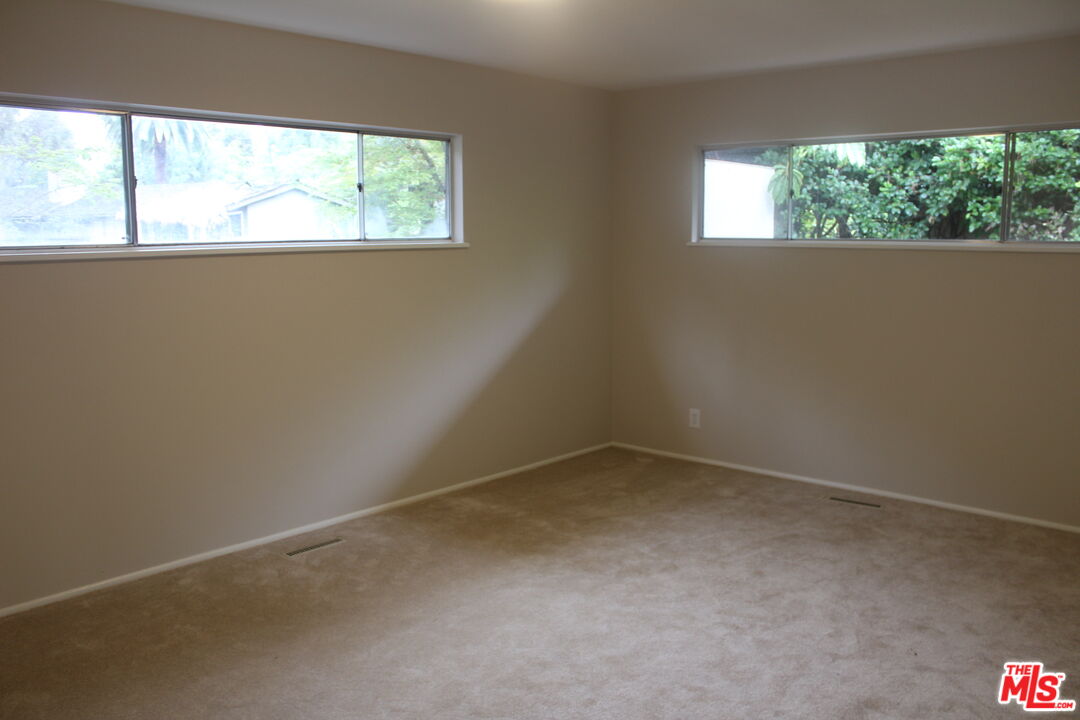 282 Wigmore Drive Pasadena, CA 91105 - Photo 11 of 15 an empty room with a window