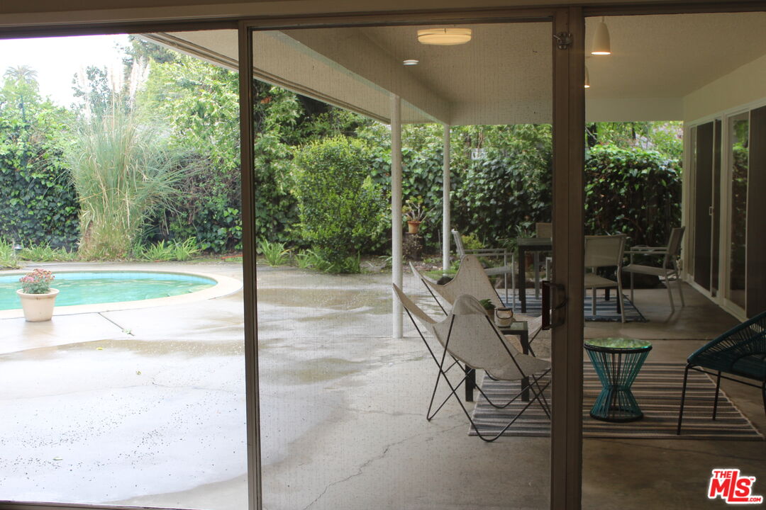 282 Wigmore Drive Pasadena, CA 91105 - Photo 14 of 15 a view of a porch with chairs and backyard
