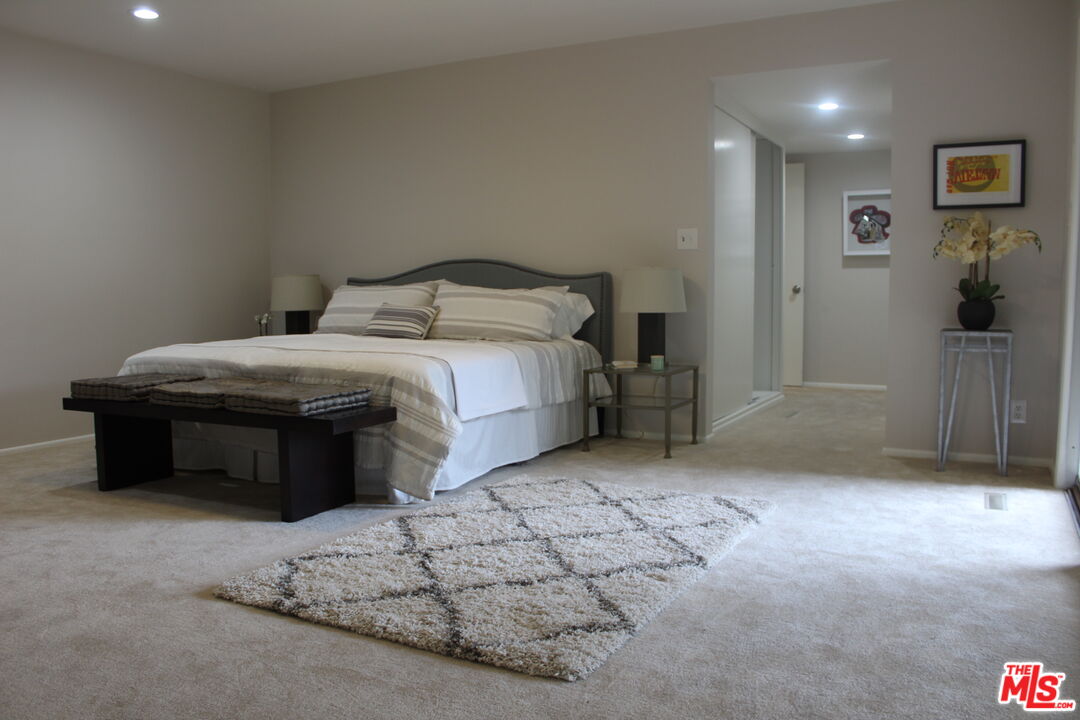 282 Wigmore Drive Pasadena, CA 91105 - Photo 7 of 15 a bedroom with a bed and a cabinets