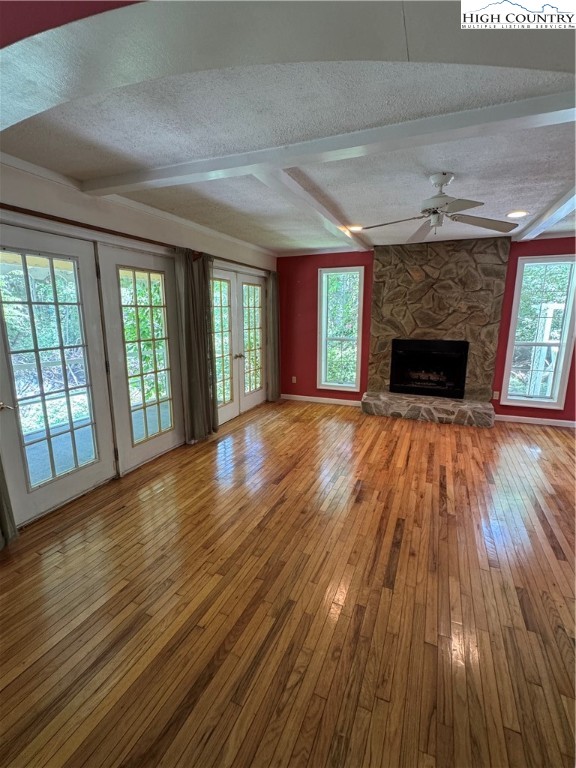 232 Cole Hollow Road Newland, NC 28657 - Photo 11 of 31 wooden floor fireplace and windows in an empty room
