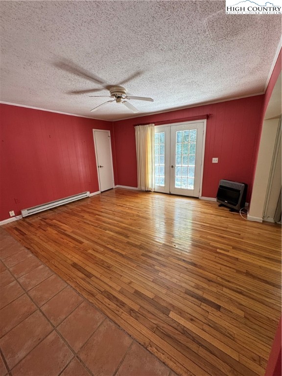 232 Cole Hollow Road Newland, NC 28657 - Photo 17 of 31 a view of empty room with wooden floor and fan